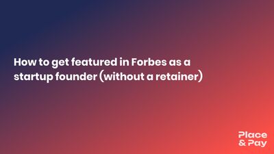 Startup founder reading their Forbes feature on a laptop